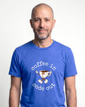 Coffee In Code Out in Heather True Royal on Bella+Canvas 3001, worn by Oliver. AI-generated model.