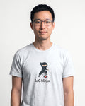 IaC Ninja in Ash on Bella+Canvas 3001, worn by Kenji. AI-generated model.