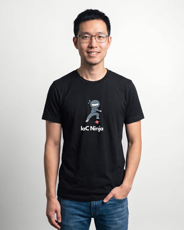 IaC Ninja in Black on Bella+Canvas 3001, worn by Kenji. AI-generated model.