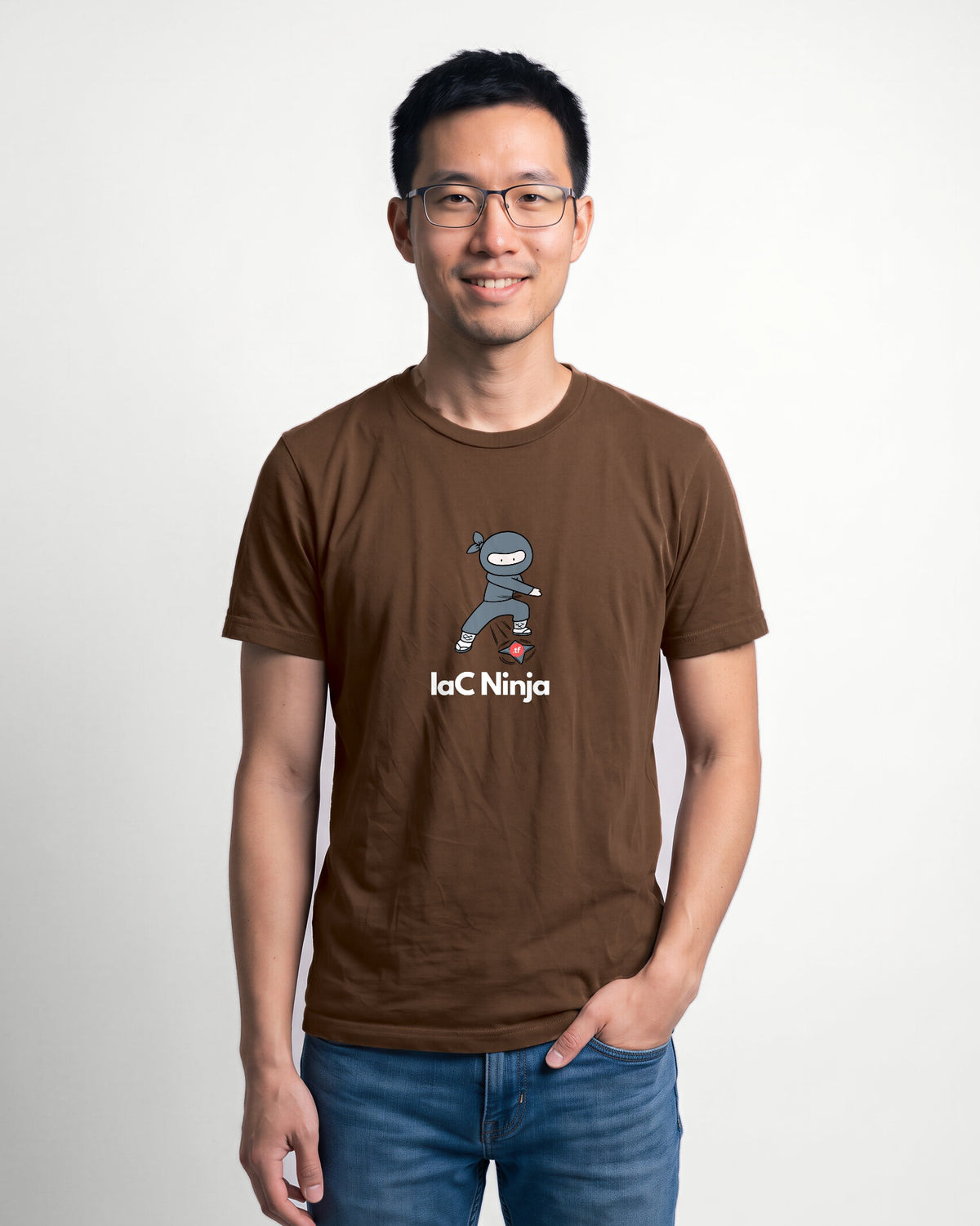 IaC Ninja in Brown on Bella+Canvas 3001, worn by Kenji. AI-generated model.