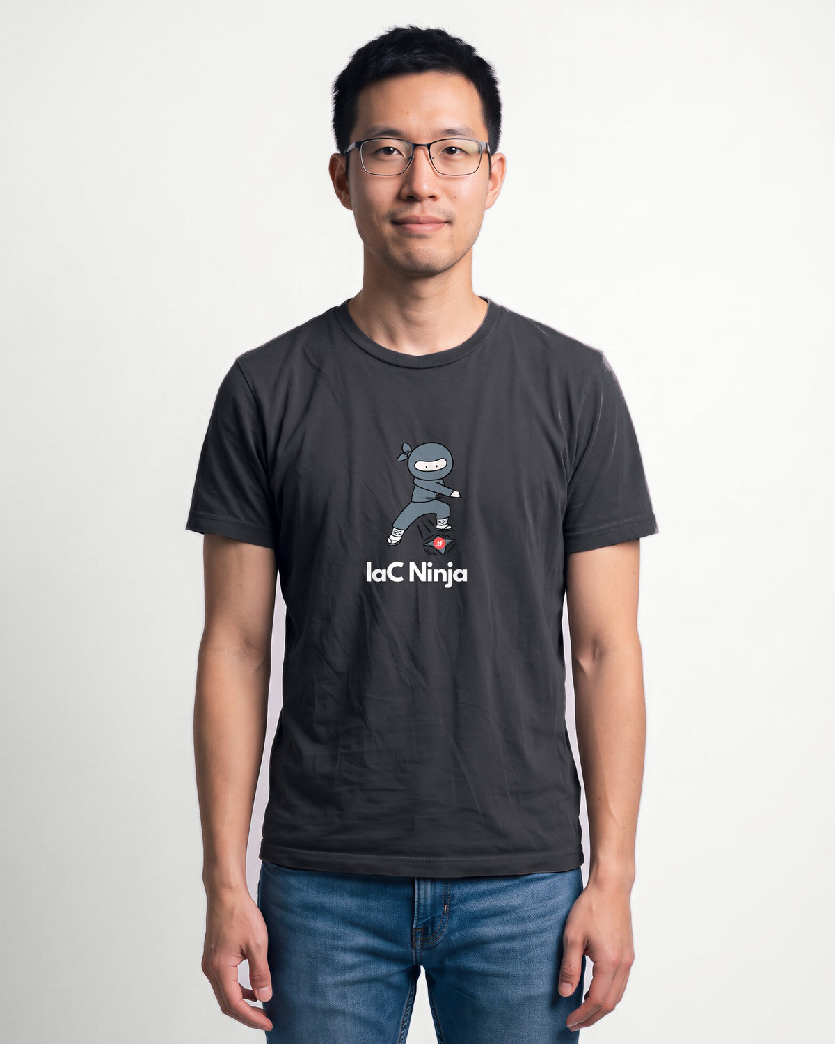 IaC Ninja in Dark Grey Heather on Bella+Canvas 3001, worn by Kenji. AI-generated model.
