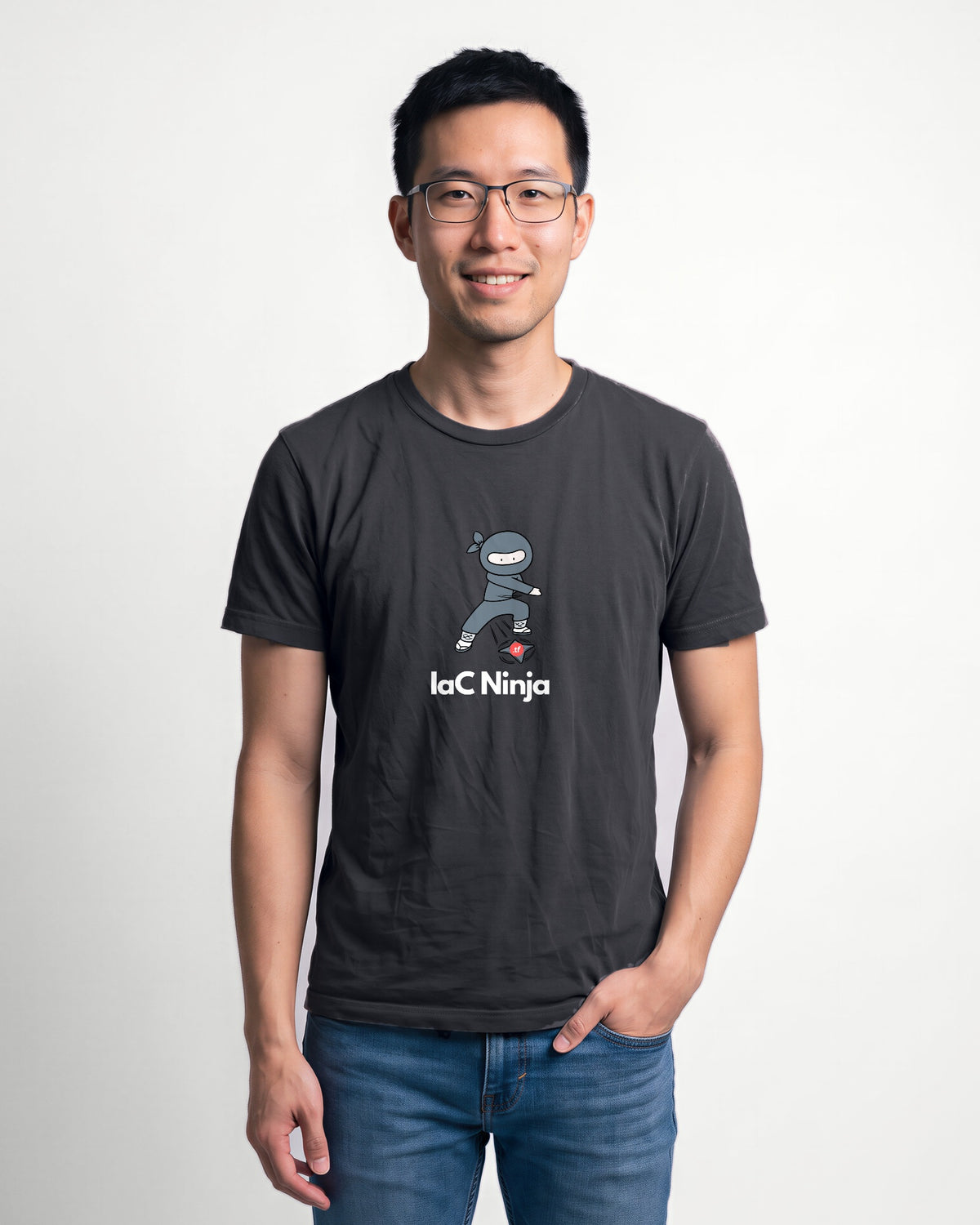 IaC Ninja in Dark Grey Heather on Bella+Canvas 3001, worn by Kenji. AI-generated model.