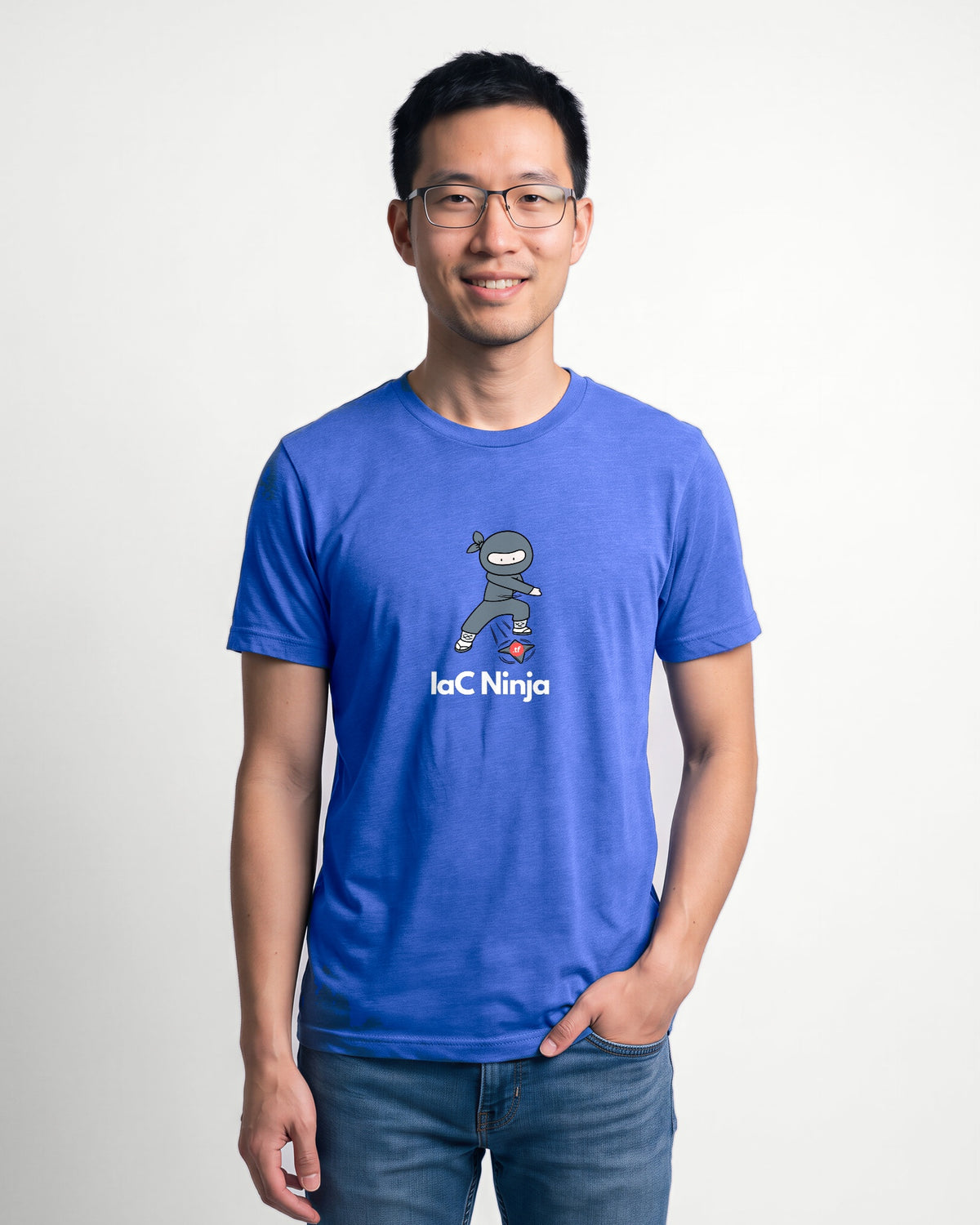 IaC Ninja in Heather True Royal on Bella+Canvas 3001, worn by Kenji. AI-generated model.