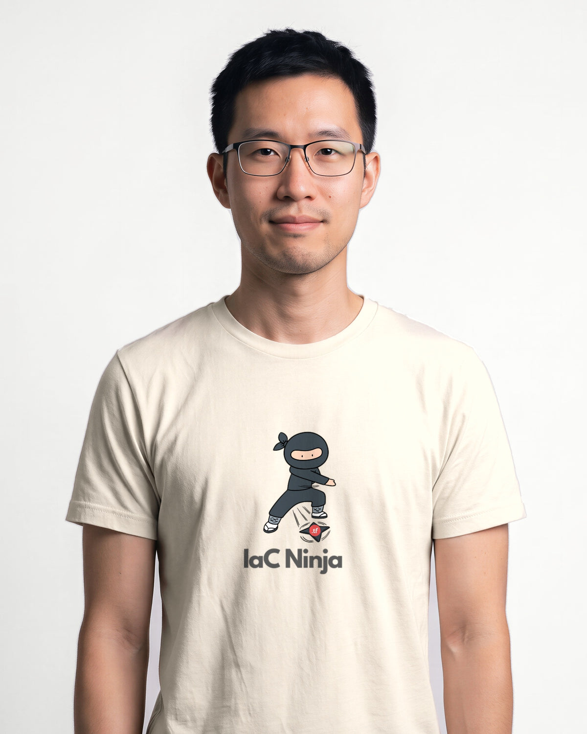 IaC Ninja in Natural on Bella+Canvas 3001, worn by Kenji. AI-generated model.