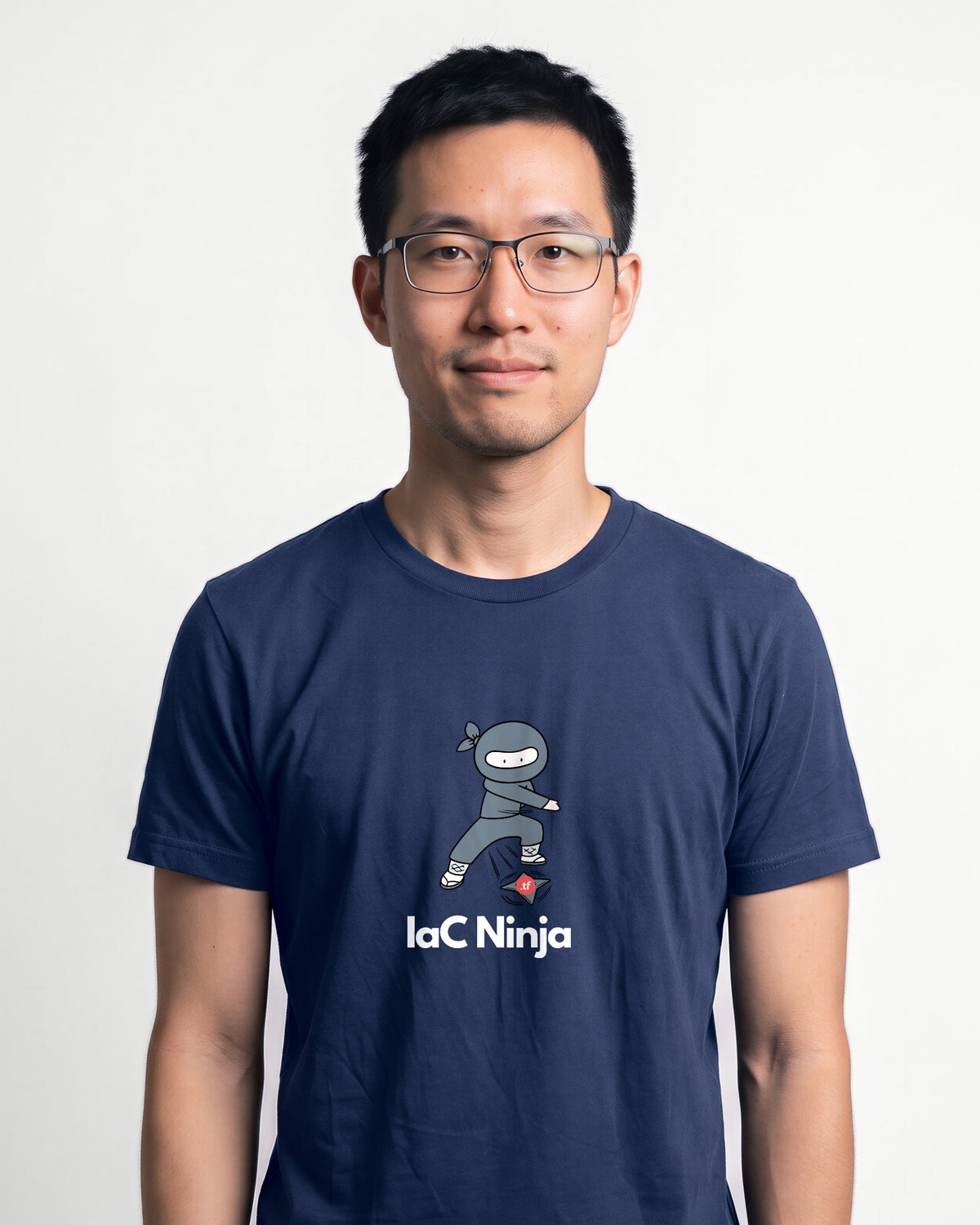 IaC Ninja in Navy on Bella+Canvas 3001, worn by Kenji. AI-generated model.