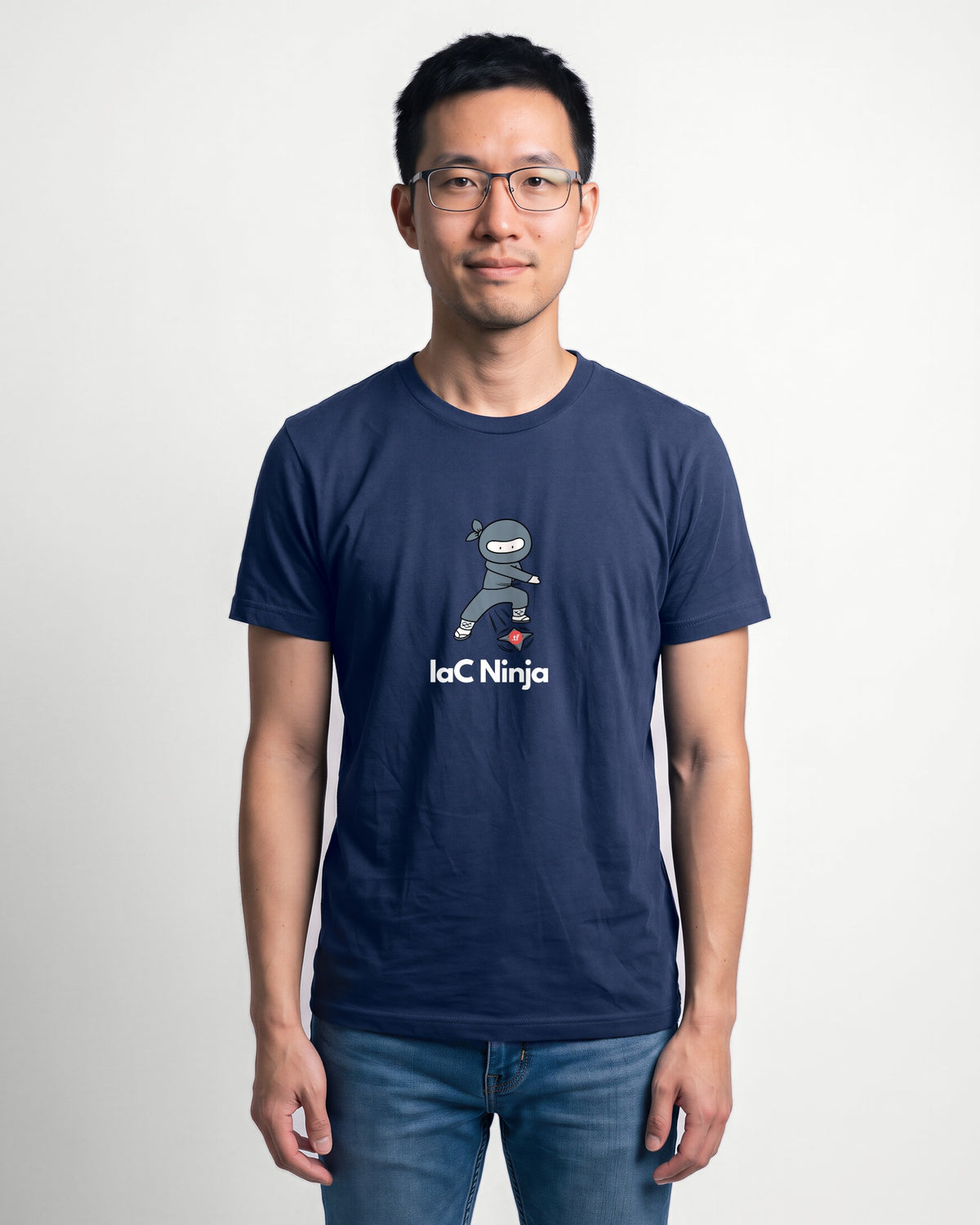 IaC Ninja in Navy on Bella+Canvas 3001, worn by Kenji. AI-generated model.
