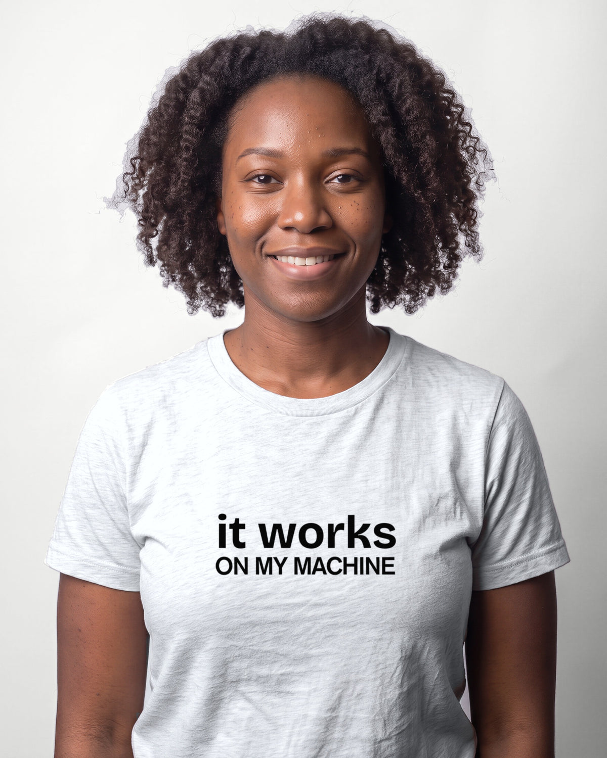 It works on my machine in Ash on Bella+Canvas 3001, worn by Nia. AI-generated model.