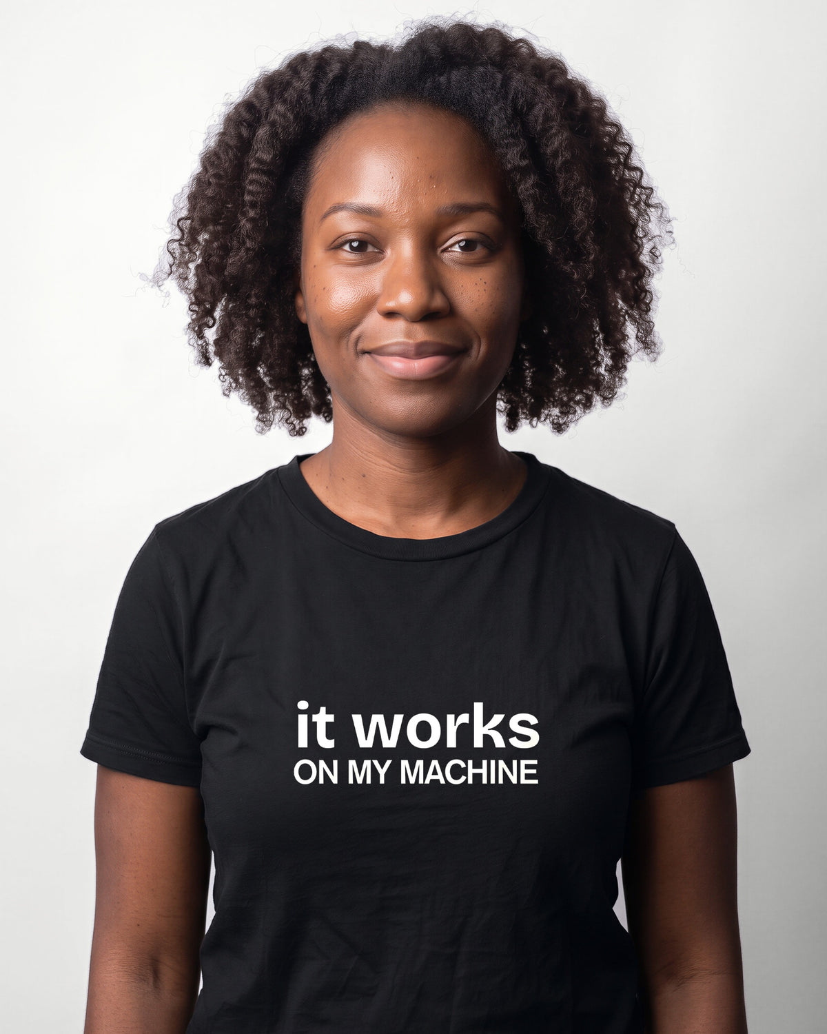 It works on my machine in Black on Bella+Canvas 3001, worn by Nia. AI-generated model.
