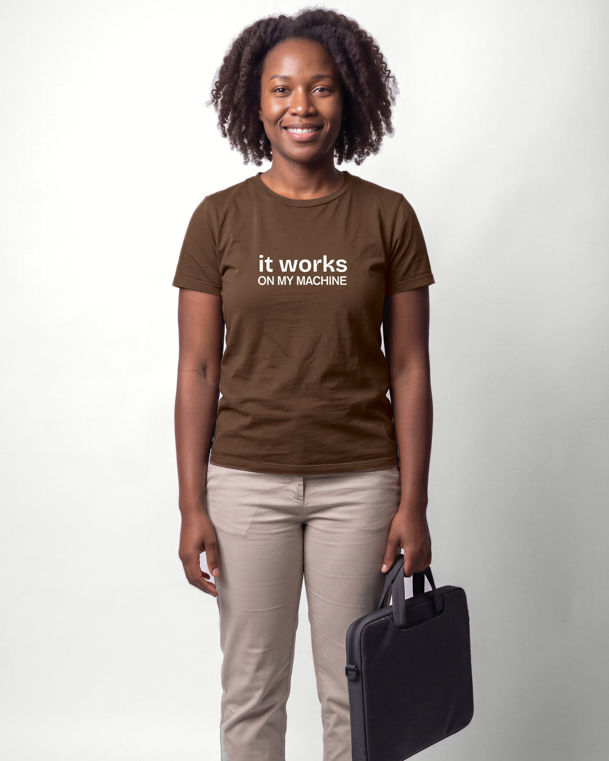 It works on my machine in Brown on Bella+Canvas 3001, worn by Nia. AI-generated model.