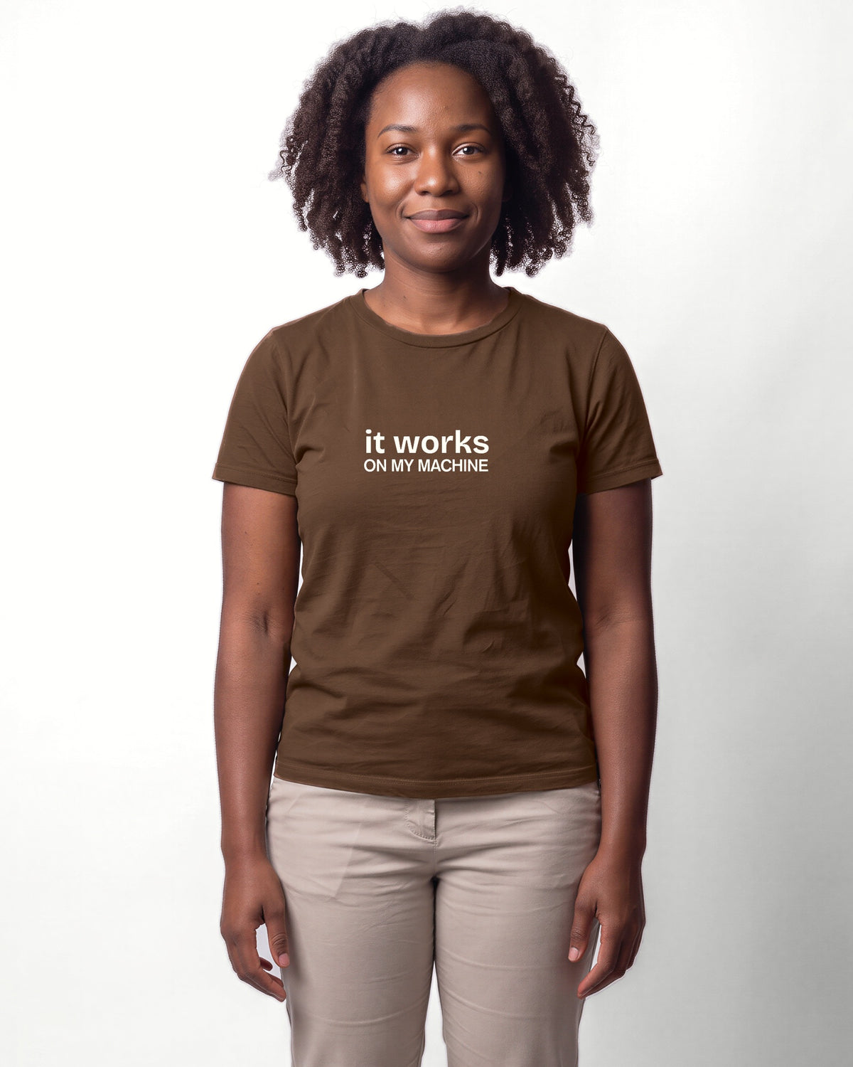 It works on my machine in Brown on Bella+Canvas 3001, worn by Nia. AI-generated model.