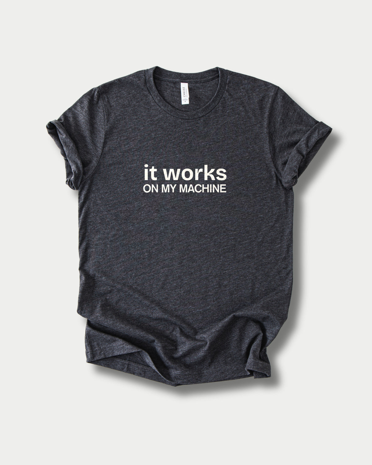 It works on my machine in Dark Grey Heather on Bella+Canvas 3001, laid flat.